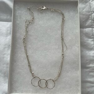 Elegant Silver Triple Ring Necklace